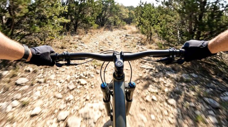 Bike rider checking front wheel wobble before Austin trail ride